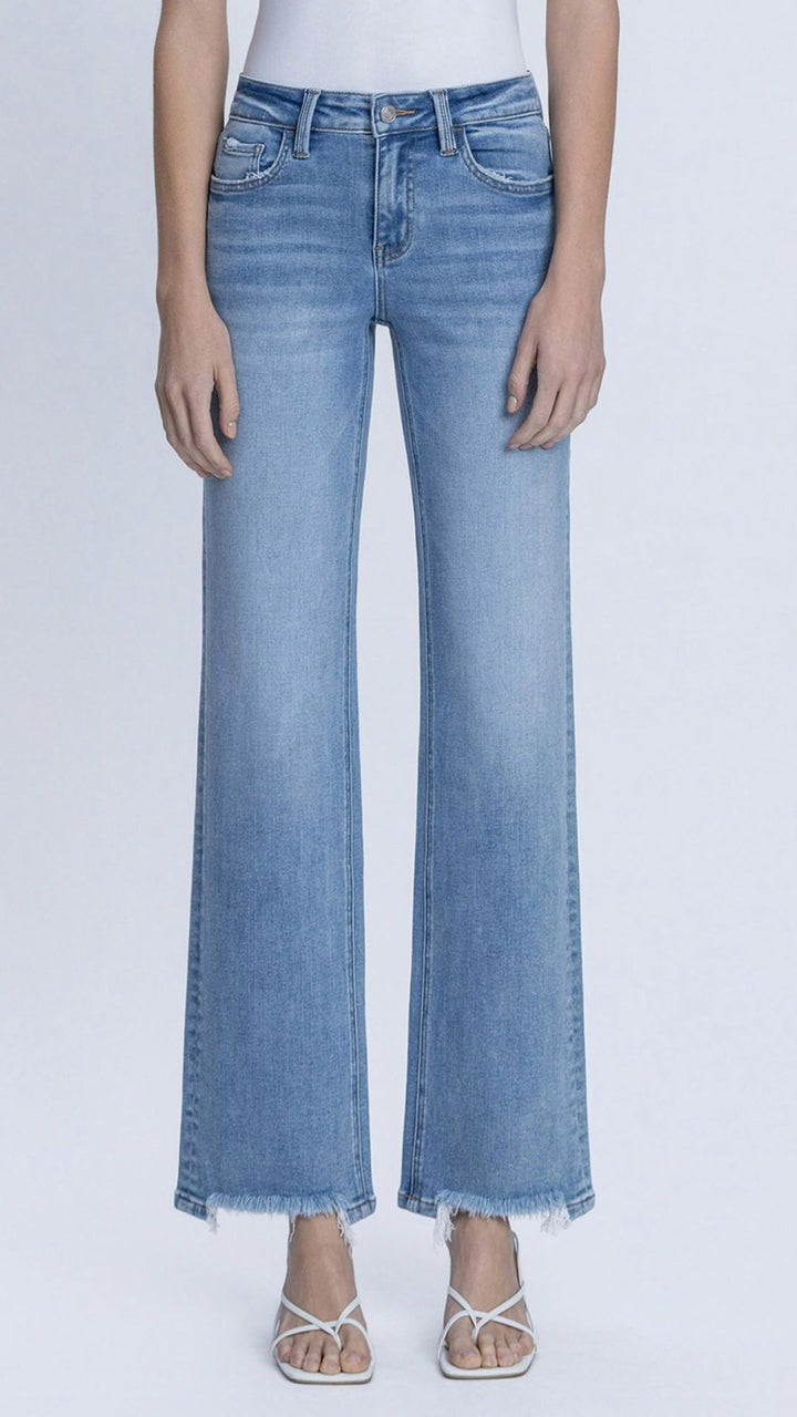 Mid Rise Medium Wash Full Length Distressed Hem Slim Wide Leg Jeans