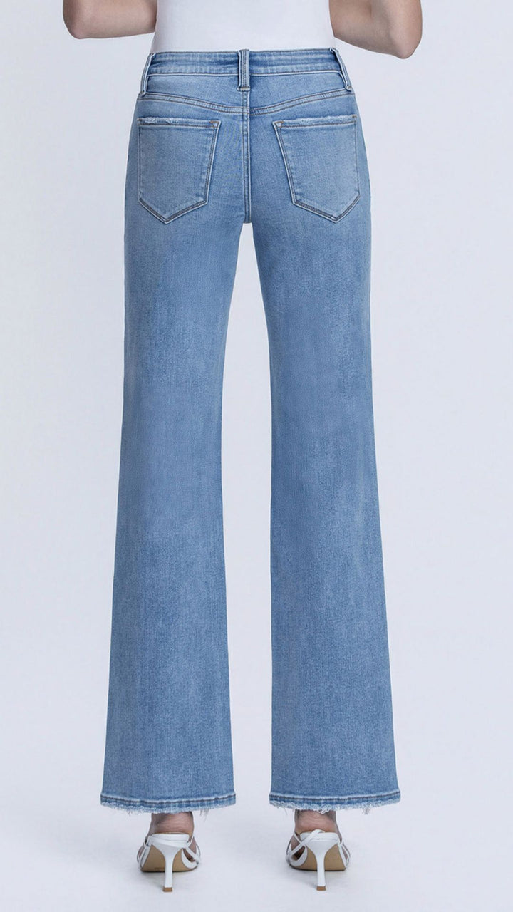 Mid Rise Medium Wash Full Length Distressed Hem Slim Wide Leg Jeans