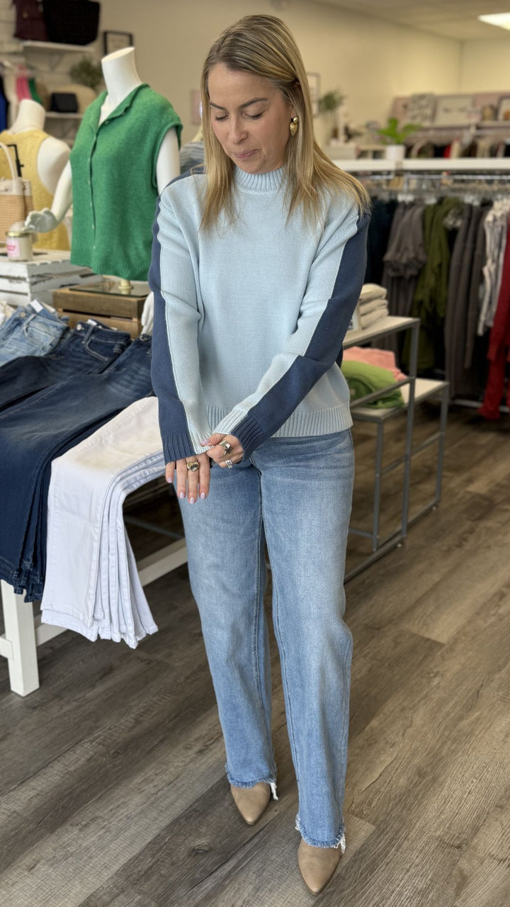 Mid Rise Medium Wash Full Length Distressed Hem Slim Wide Leg Jeans