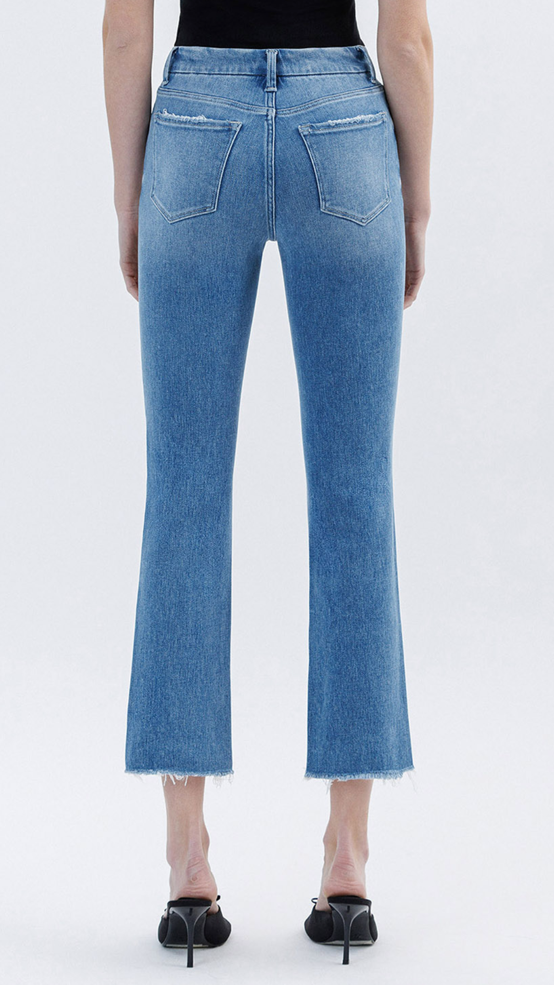 High Rise Medium Wash Raw Slant Hem Slim Straight Jeans