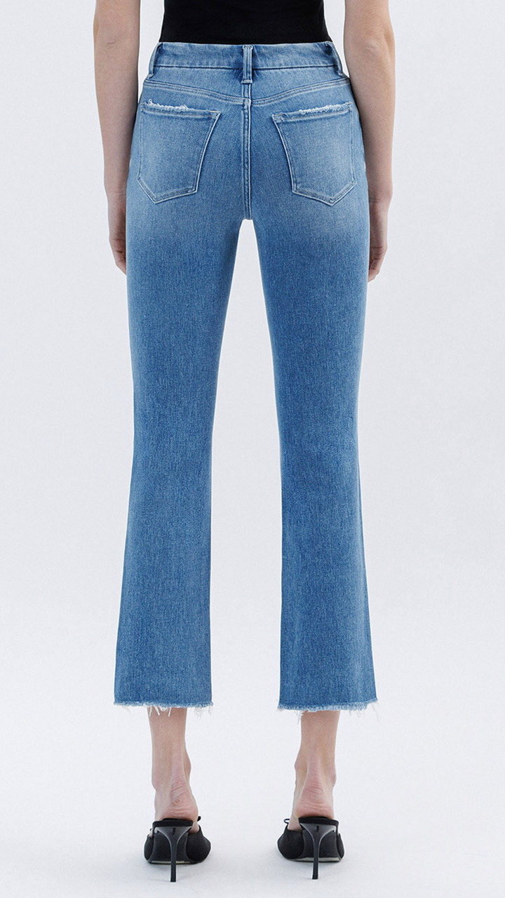 High Rise Medium Wash Raw Slant Hem Slim Straight Jeans