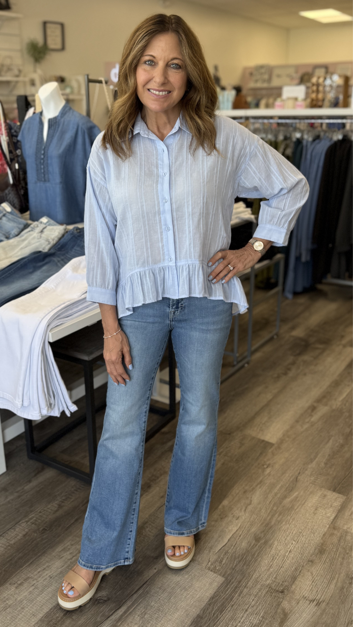 Mid Rise Medium Wash Full Length Flare Jeans