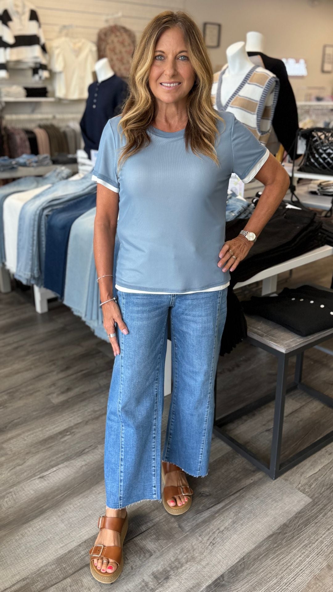 High Rise Medium Wash Raw Hem Twist Wide Leg Jeans