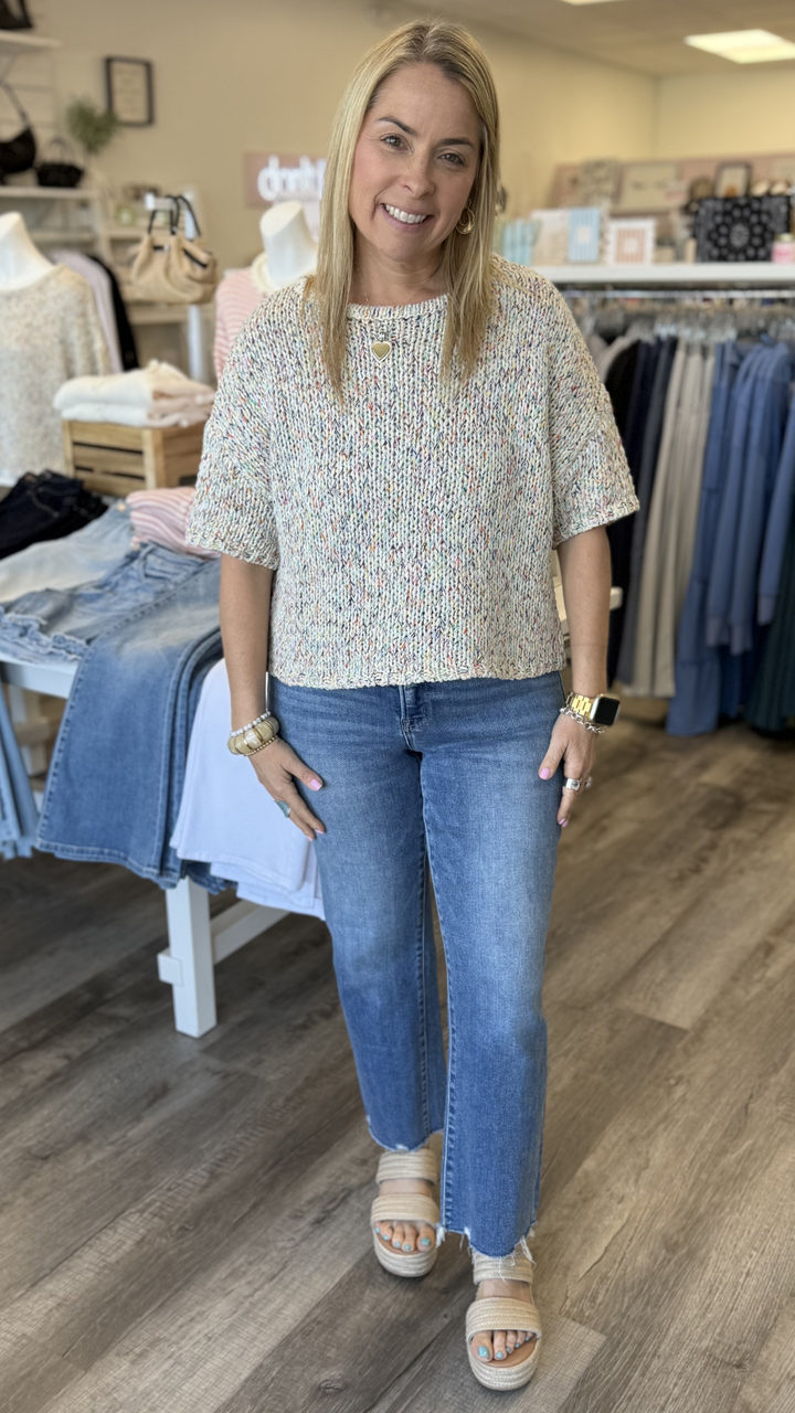 Mid Rise Medium Wash Distressed Hem Crop Straight Jeans